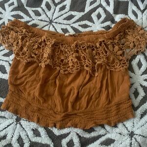 Indulge Gold-ish, brown crop top with dangly lacey design.